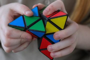 girl showing bright brainteaser in hands