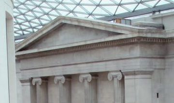 people waling inside white concrete building