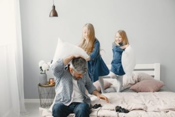 kids in blue denim dress playing with pillows